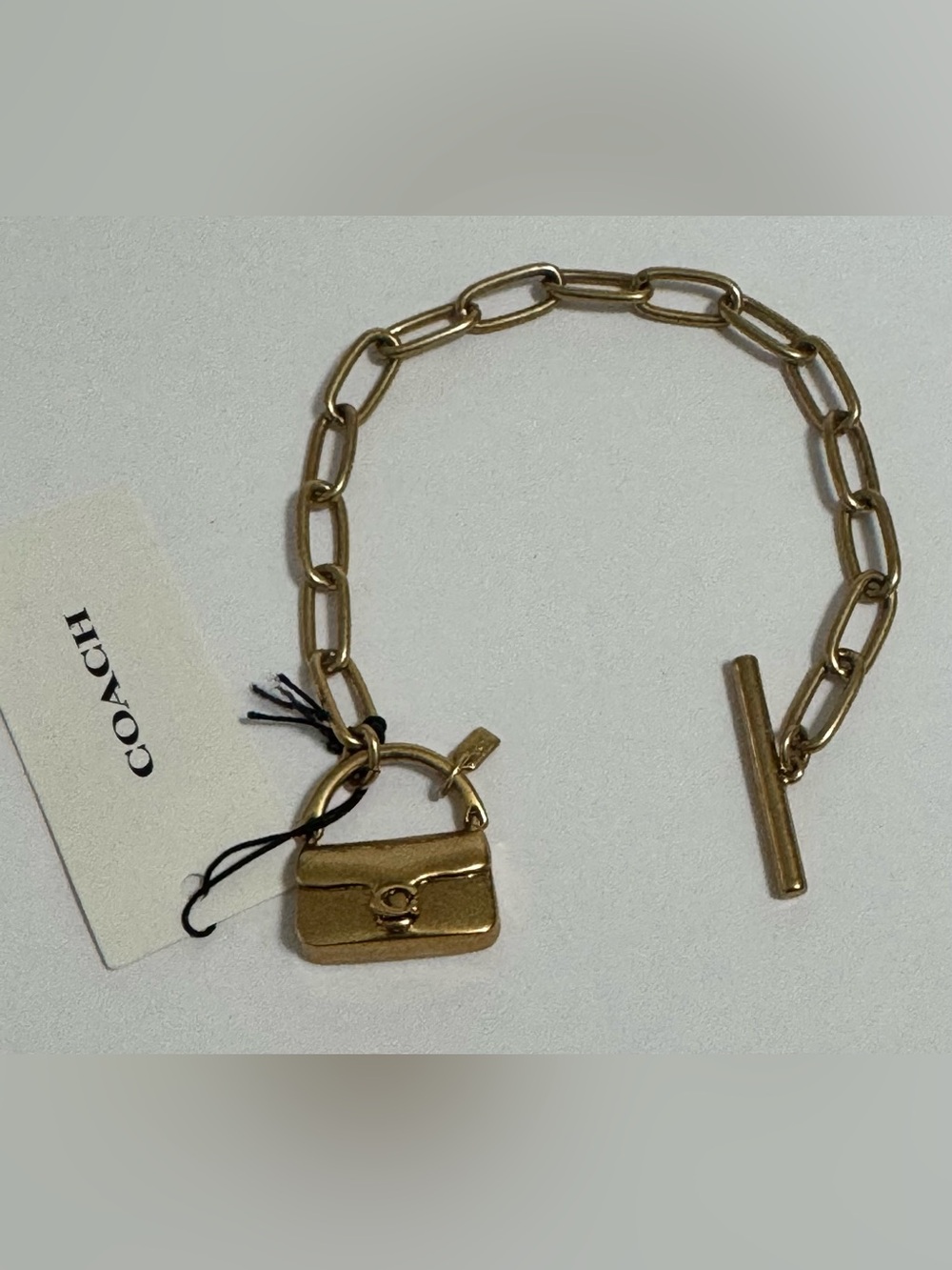 Coach Gold-Tone Link Bracelet with Tabby Purse Charm